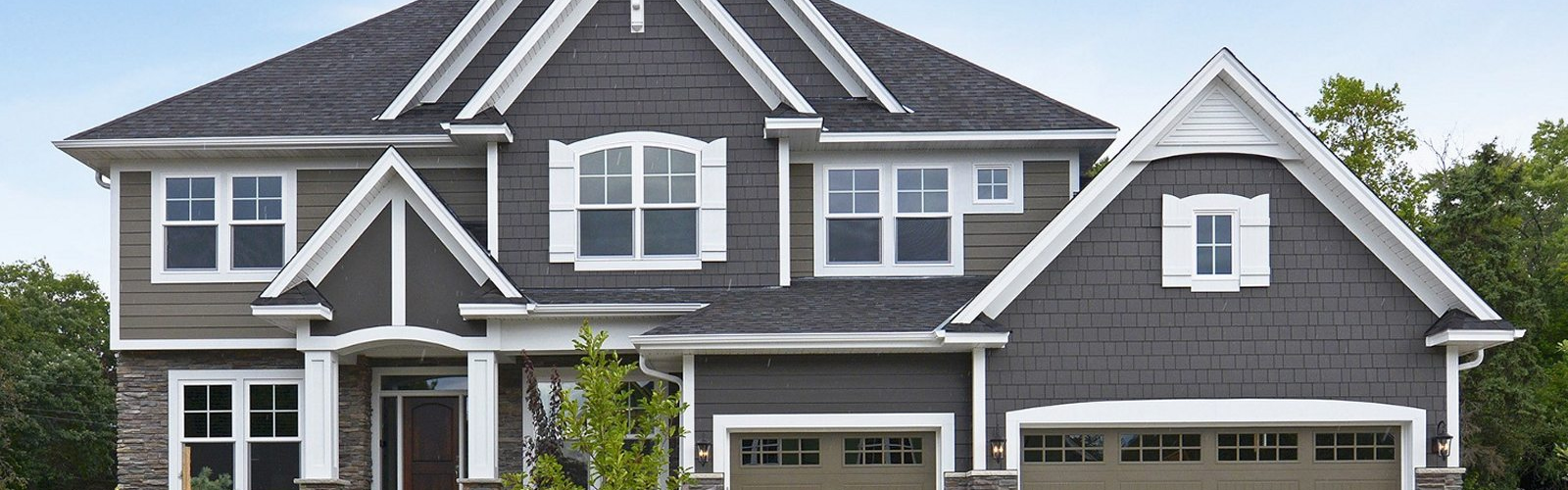 Mid-class home with dark gray siding